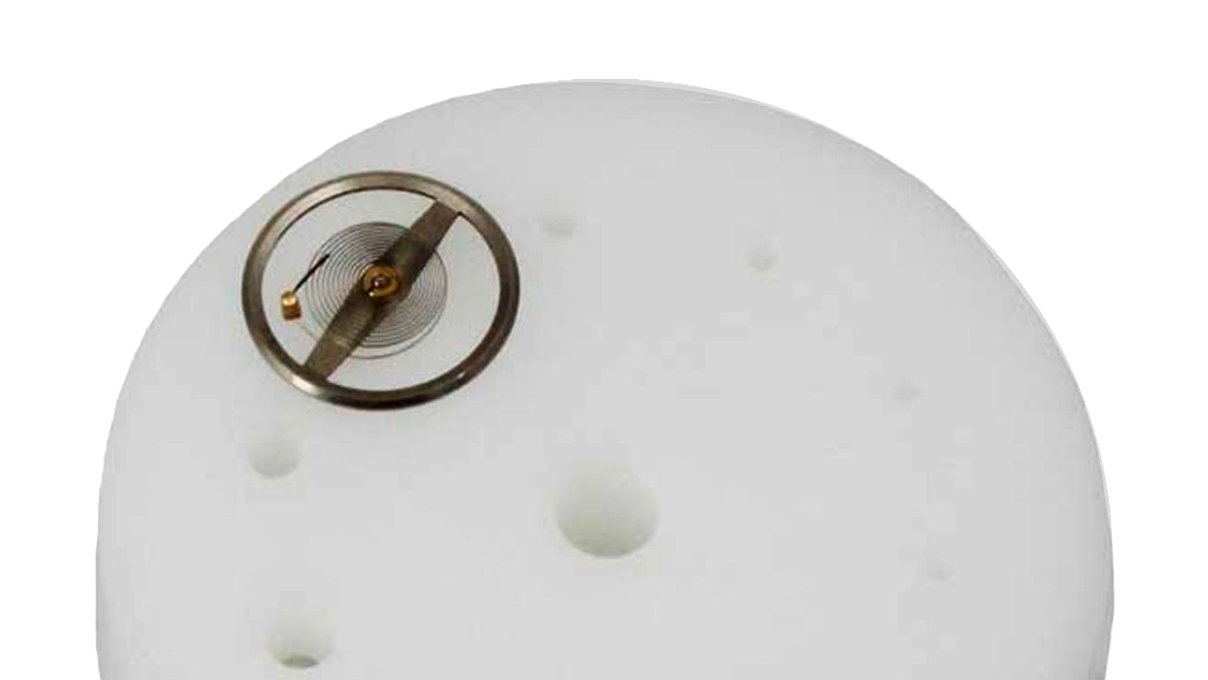 Plate with 11 holes for holding and adjusting hairsprings and balance springs, nylon